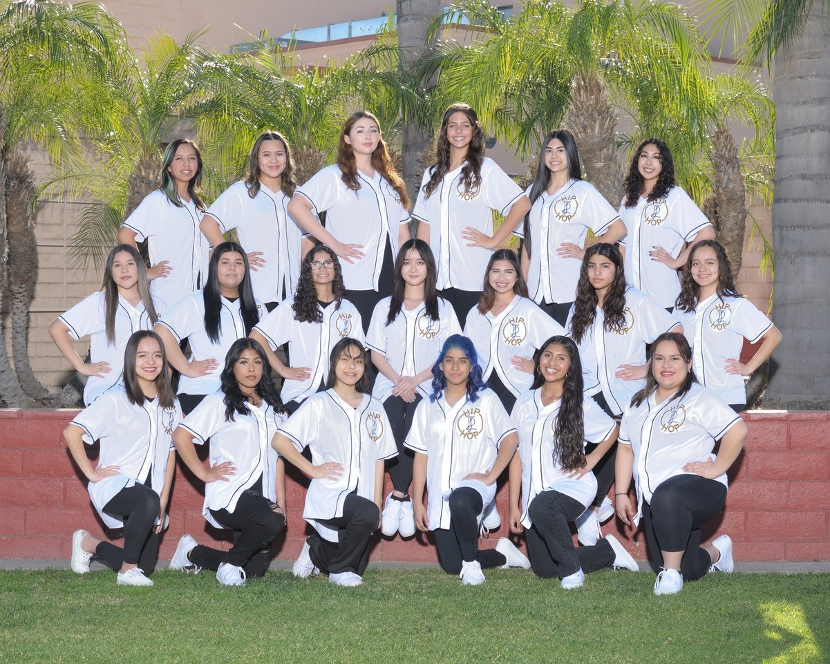 A group of people posing for a photoDescription automatically generated