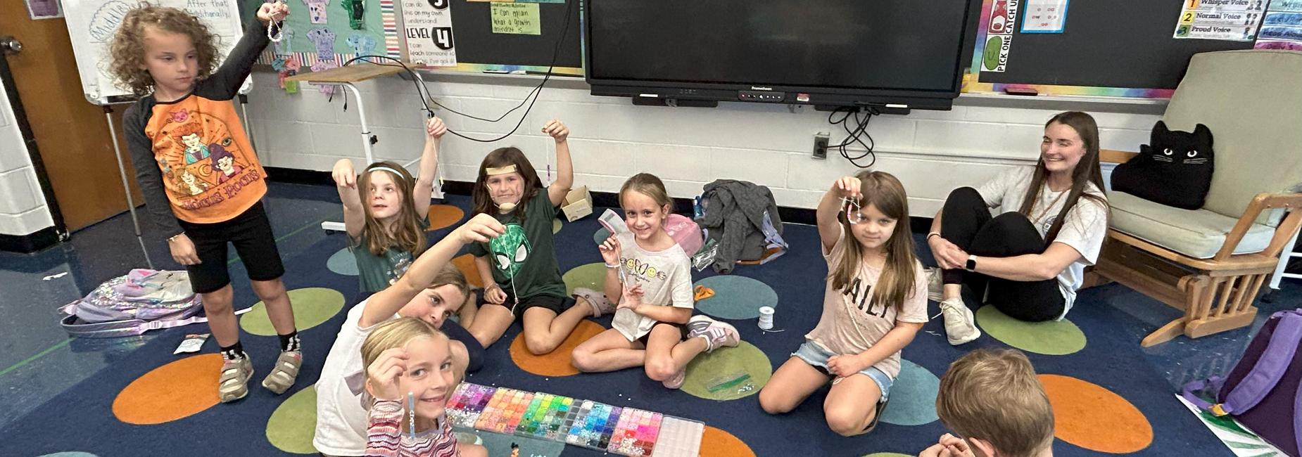 Students making bracelets