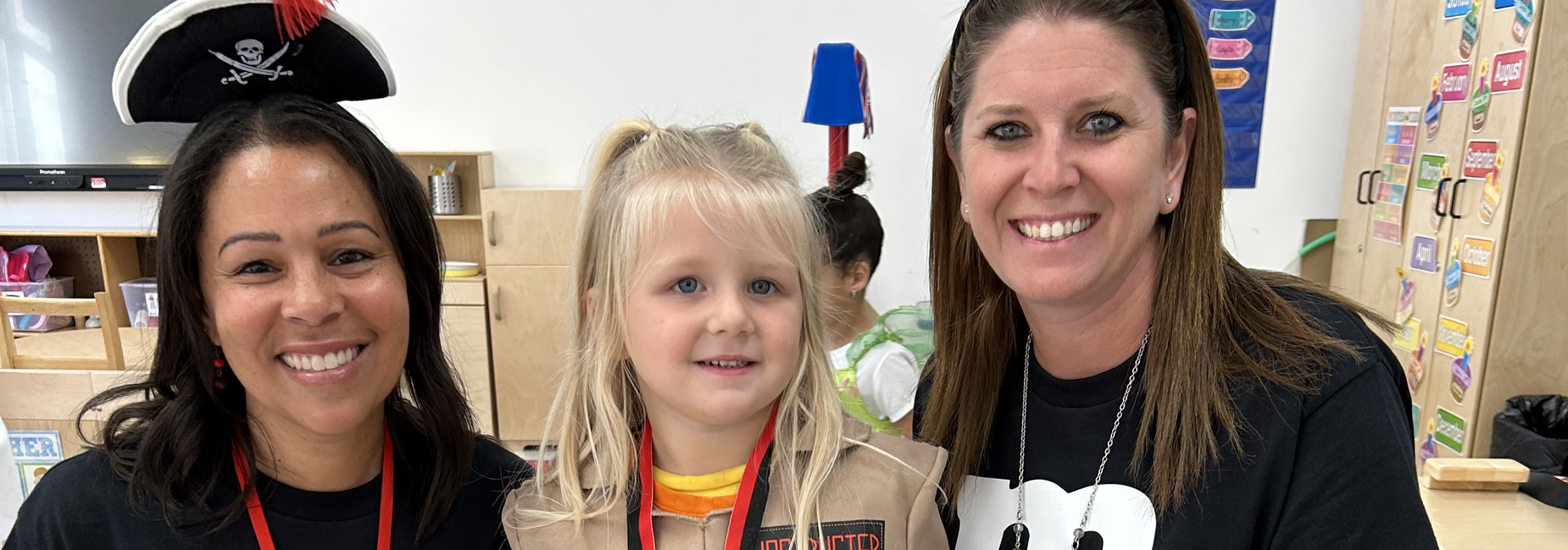 Mrs. Jones and Mrs. Oliver with a student