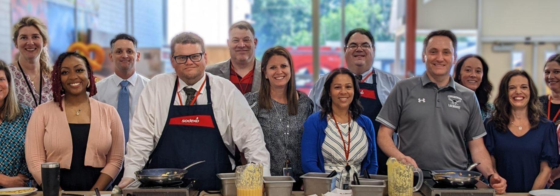 Administrators serve breakfast