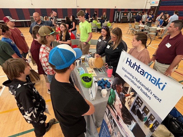  Huhtamaki staff engage with Oswego County P-TECH students at Bridge Week event.