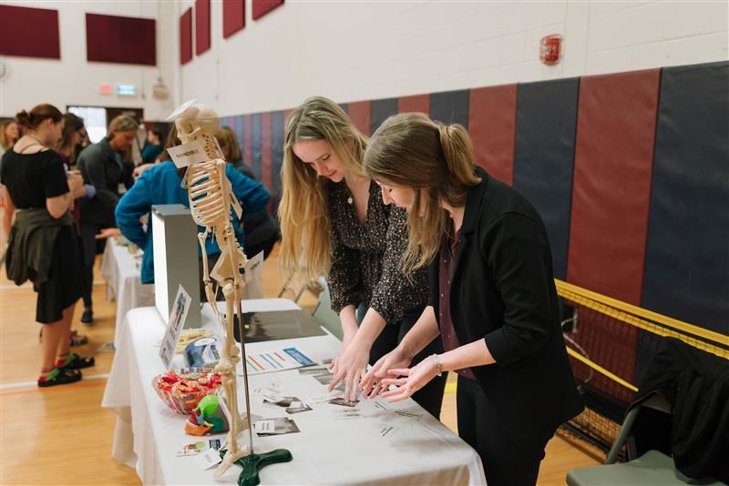 Two industry representatives at their display table