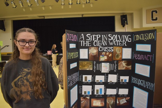 Riley Watkins displays science fair project