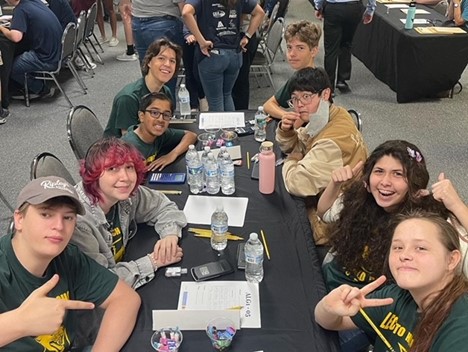 LHS students sitting at a table