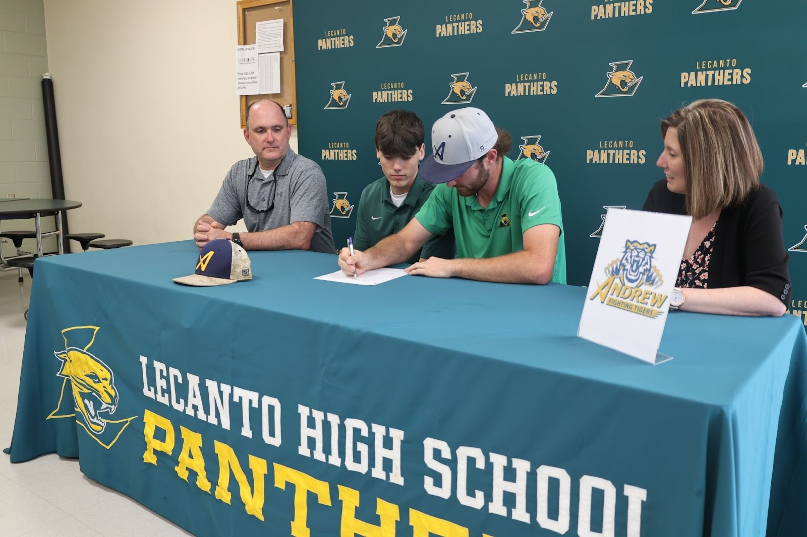 4 people seated at a table 