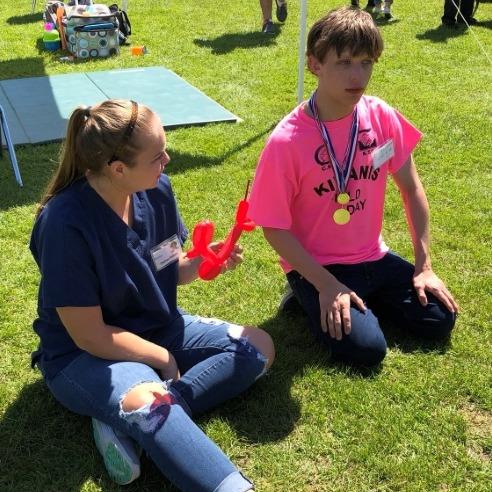 students talking in grass