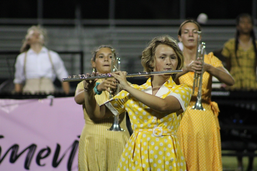 student playing in band