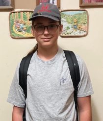 teenage boy with a hat and backpack