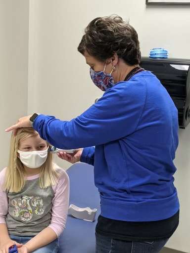Nurse Cindy with a patient