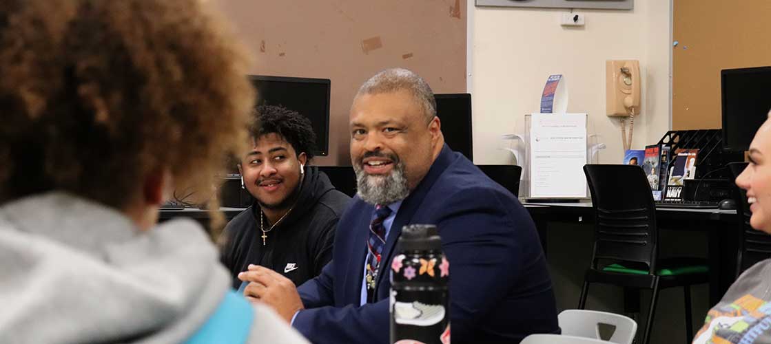 Superintendent Ron Banner works with a diverse group of students