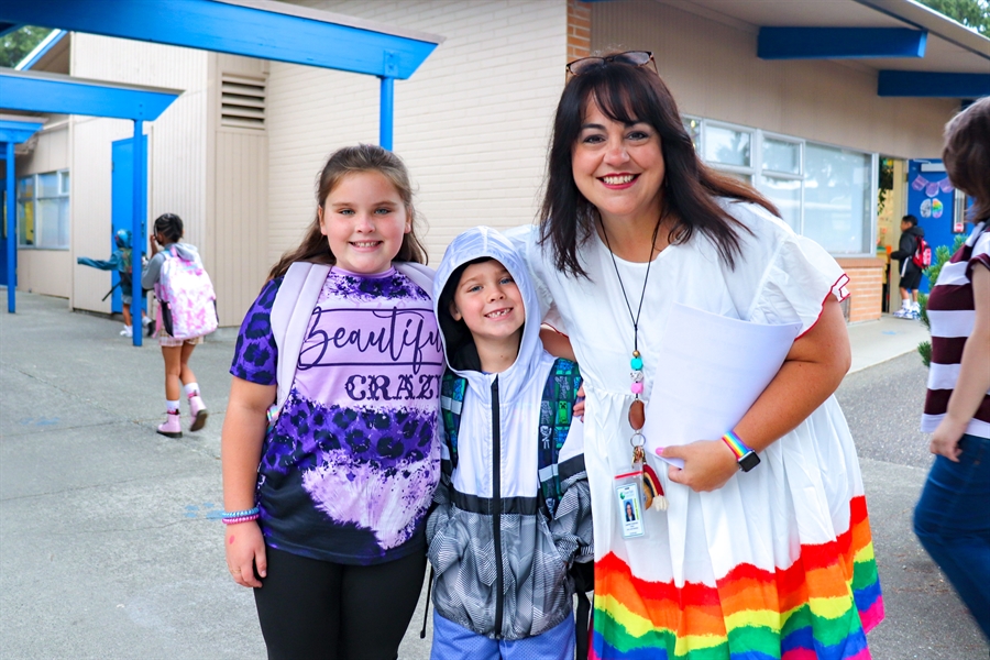 Teacher and students smiling. Teacher and students smiling.