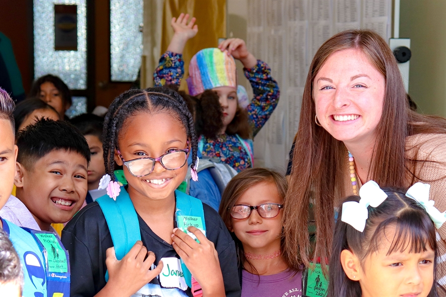 Teacher and students smiling