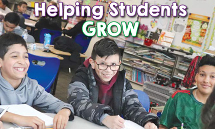 Three boys sitting at a desk while a teacher talks to them the text overlaid stating "Helping Students Grow" Three boys sitting at a desk while a teacher talks to them the text overlaid stating "Helping Students Grow"