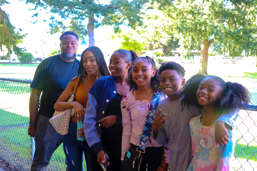 Happy family of six smiling