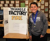 Mickey Cox student showing his history board