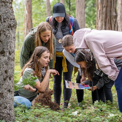 Student and Naturalist on trail