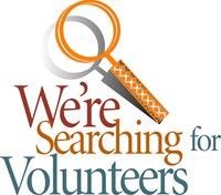 sign reading "We are searching for volunteers"