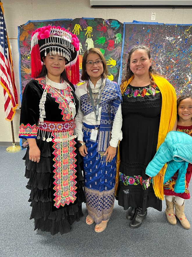 Teacher Sakhone with students in costume.