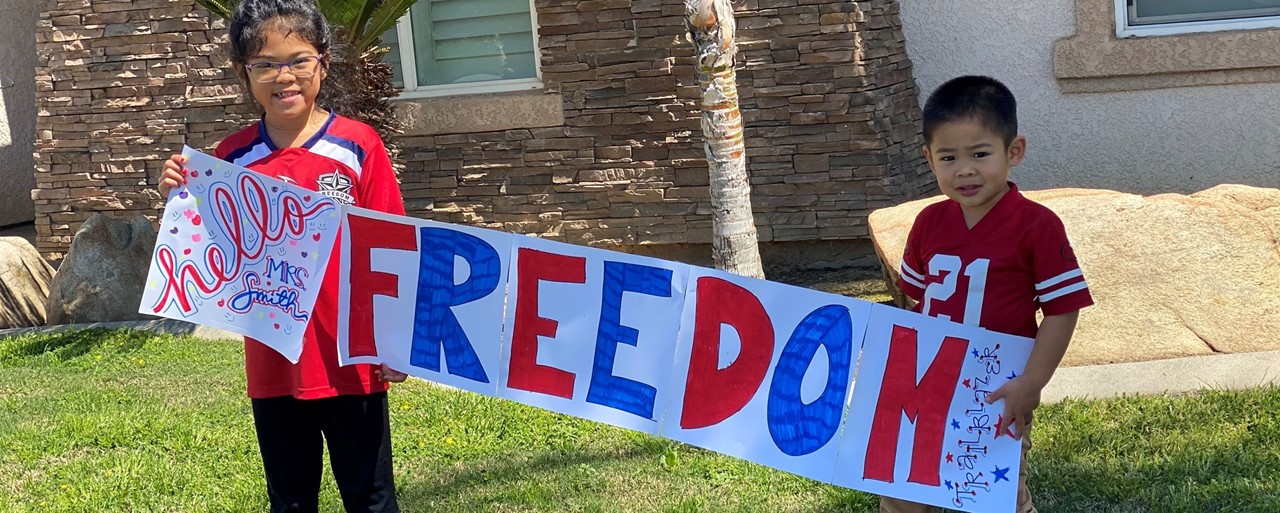 Students holding Freedom Sign