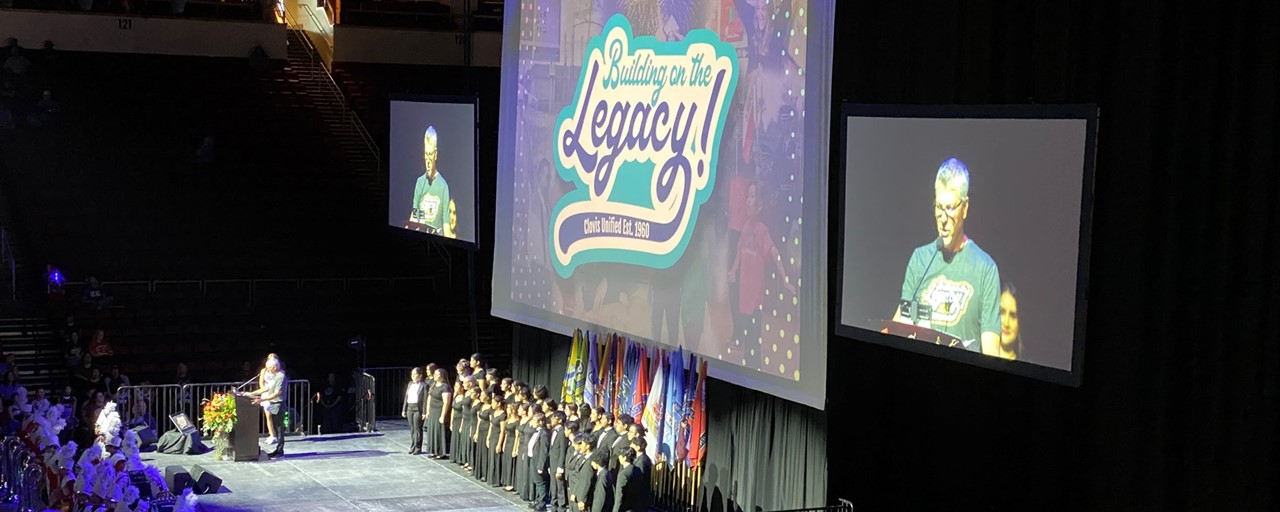 Image of CUSD General Session kick-off to the new school year with CUSD staff at the Savemart Center listening to a speaker on stage.