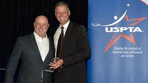 Tony Cherone receiving his United States Professional Tennis Association Coach of the Year trophy.