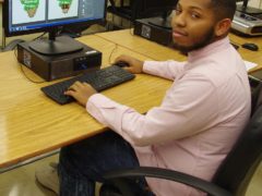 Keondez Robinson sitting at computer