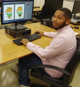 Keondez Robinson sitting at computer