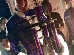 CHS Band Member Holding Trophy