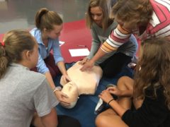 Students watching CPR instruction