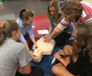 Students watching CPR instruction