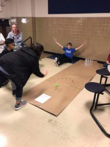 Family playing bowling game.