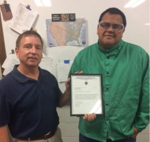 CAVC welding instructor Mark Anderson with Jason Boley