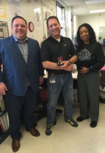 Jason Rehg of Edward Jones, Teacher of the Month Kevin Pysz and CMS Principal Dr. Kim Jackson