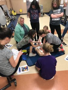 DIS students learning CPR