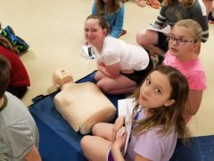 DIS students with CPR dummy