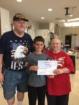 Student Elliott Schusky with James and Kathy Conn representing the VFW