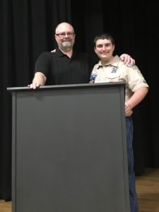 Brad and Hunter Snow with new podium at Webster Elementary