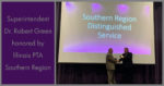 Dr. Green Receives Award from Greg Hobbs