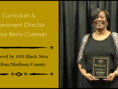 Latoya Berry-Coleman with award