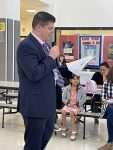 Superintendent Dr. Skertich reads a Young Authors book