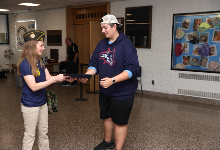 Scout of Year receives awards from VFW member.