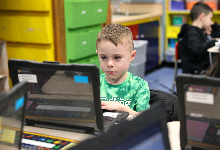 Student works on laptop.