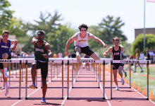 Danny competes in the hurdles at a recent event.