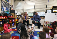 Laura Newman and Chef Chris speak in front of the class.