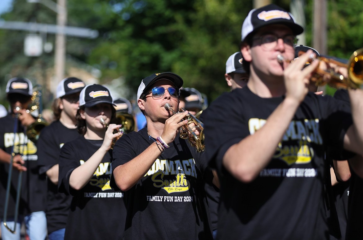 CHS marching band trumpeter plays during Commack South Little League parade.