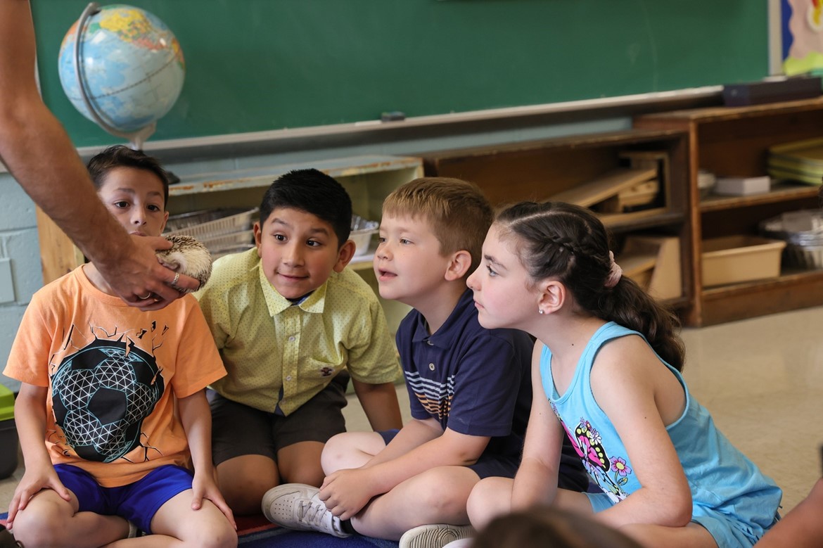 Wood Park students look at animal brought to school by Sweetbriar Nature Center.