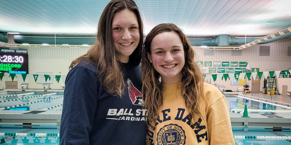 swimmers in front of pool