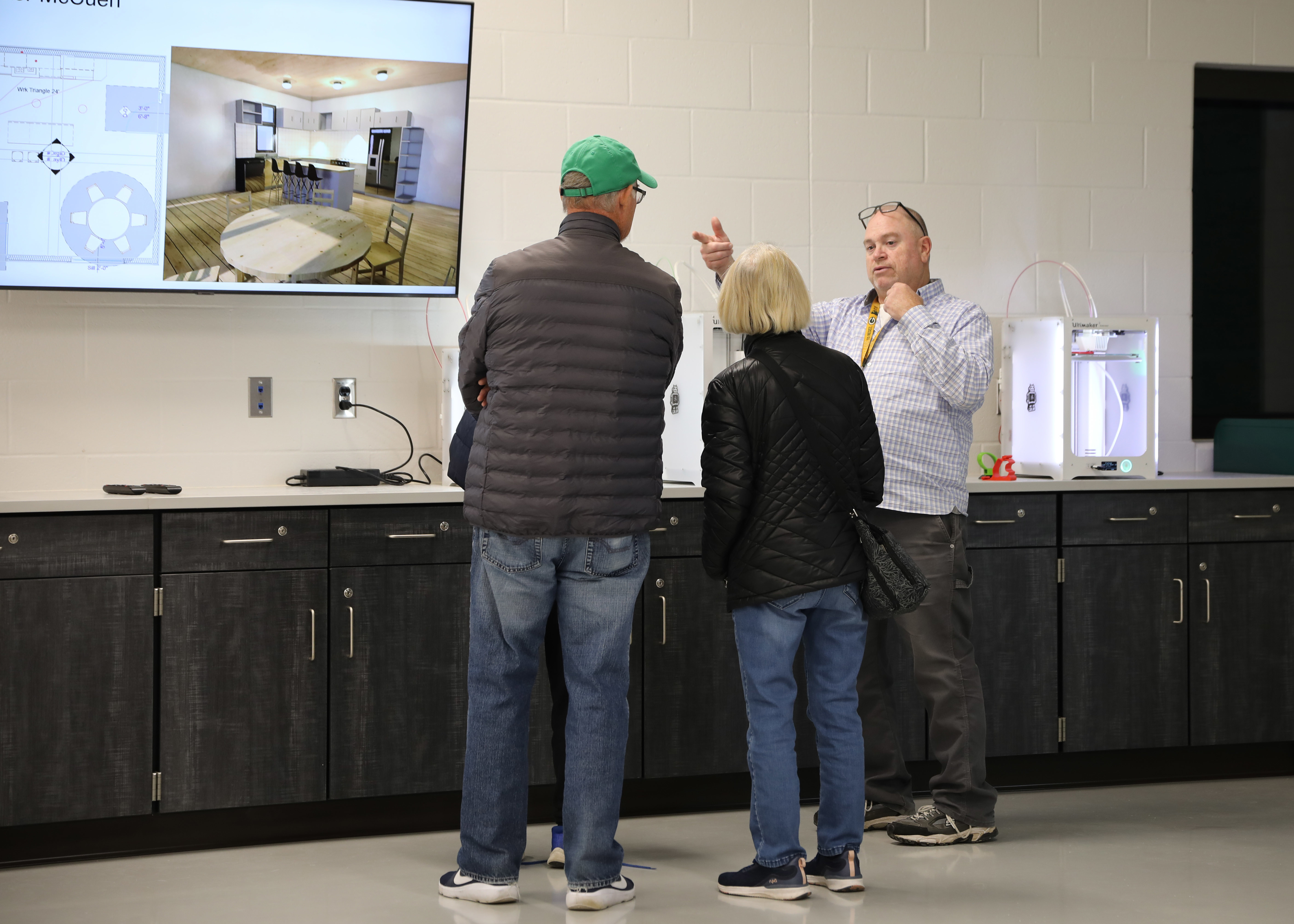 Engineering teacher Mike Dubois speaks to visitors during the open house event. Engineering teacher Mike Dubois speaks to visitors during the open house event.