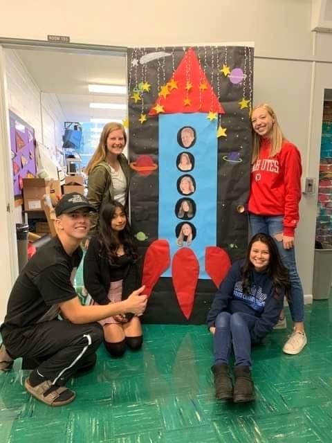 Students decorating a door.