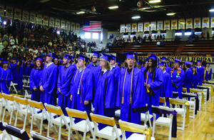 The Marshfield High School Class of 2023 watch as their final classmates enter the main gym for commencement exercises.